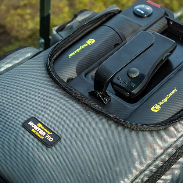 Load image into Gallery viewer, Ridgemonkey Hunter 750 Rucksack, durable and spacious fishing backpack designed to carry and protect the Hunter 750 Bait Boat and accessories. Boat in bag
