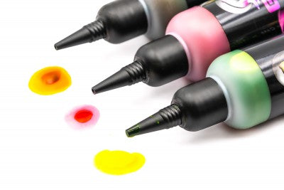 Load image into Gallery viewer, Multiple bottles of Korda Goo in various colours, designed for use in fishing, labelled with the brand and product name. Korda Good Sample colours
